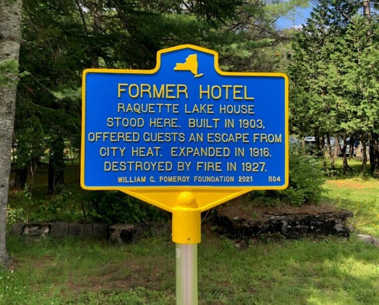 New York State historical marker for former hotel, Raquette Lake, New York.