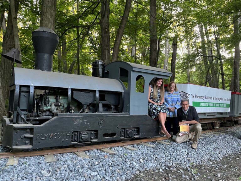 Friends of Taconic State Park (FTSP) received a Pomeroy Foundation special interest grant to support the development of The Pomeroy Family Railroad at Copake Iron Works. The $100,000 gift was announced at FTSP’s annual meeting in July 2022. Pictured, left to right, are Foundation Trustee & Director of Strategic Initiatives Deryn Pomeroy, Foundation Executive Director Carrie Berse and FTSP Board of Directors President Jim Mackin.