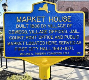 Historical marker for the Market House in Oswego, New York. Funded by the William G. Pomeroy Foundation.