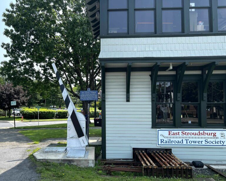 Historic Transportation marker for RR Signal Tower, East Stroudsburg, Pennsylvania. Marker with building.