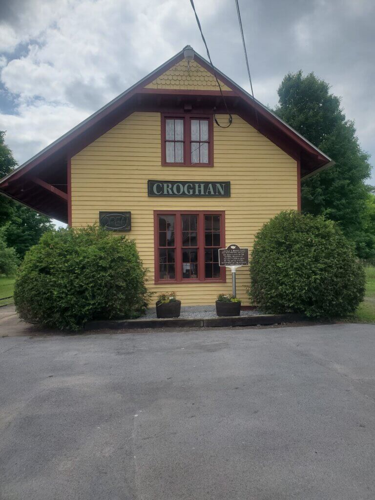 View of depot and National Register marker for the Lowville & Beaver River Railroad Historic District. Funded by the William G. Pomeroy Foundation.